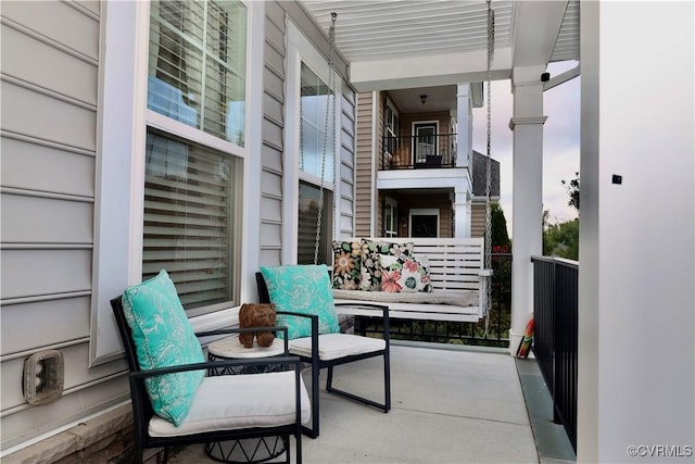 balcony featuring covered porch