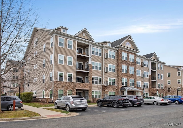 view of property featuring uncovered parking