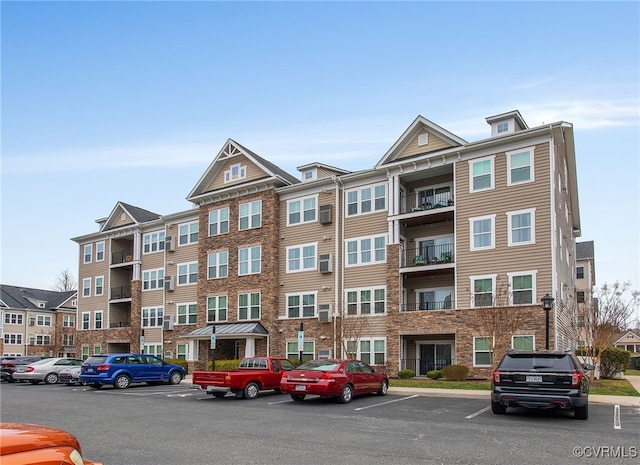 view of property featuring uncovered parking