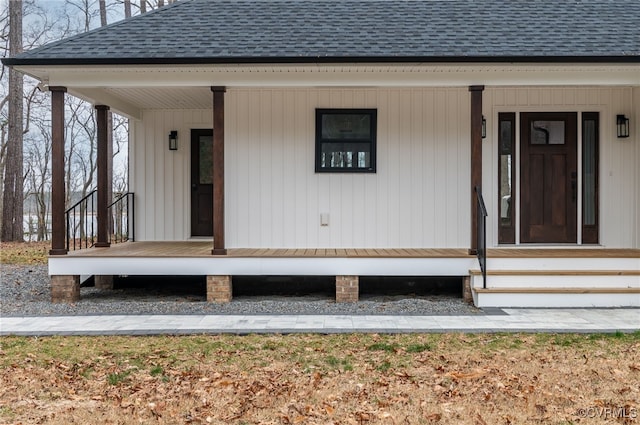 exterior space with a porch and a shingled roof