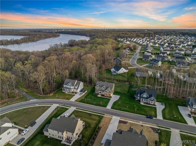 aerial view featuring a water view, a forest view, and a residential view