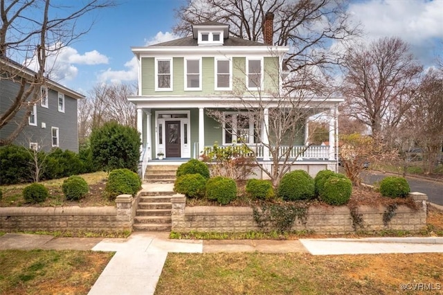traditional style home featuring a porch and a chimney