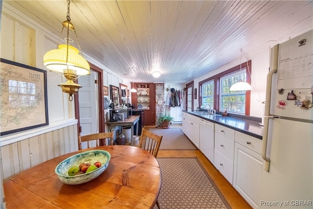 257 Horseshoe Bend Rd, Deltaville, VA 23043 - dining space featuring wooden walls, built in shelves, and wood ceiling