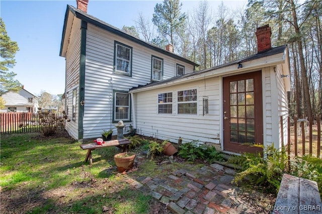 257 Horseshoe Bend Rd, Deltaville, VA 23043 - back of house featuring a chimney and a patio