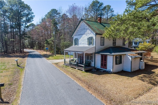 257 Horseshoe Bend Rd, Deltaville, VA 23043 - country-style home with a chimney