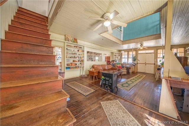 257 Horseshoe Bend Rd, Deltaville, VA 23043 - living room featuring a ceiling fan, stairway, hardwood / wood-style floors, a high ceiling, and wooden ceiling