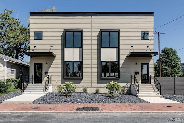 contemporary home with fence