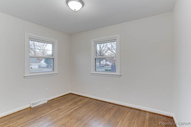 104 Clemwood Pkwy, Hampton, VA 23669 - unfurnished room featuring visible vents, plenty of natural light, light wood-style floors, and baseboards