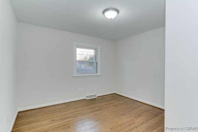 104 Clemwood Pkwy, Hampton, VA 23669 - spare room with wood finished floors, visible vents, and baseboards