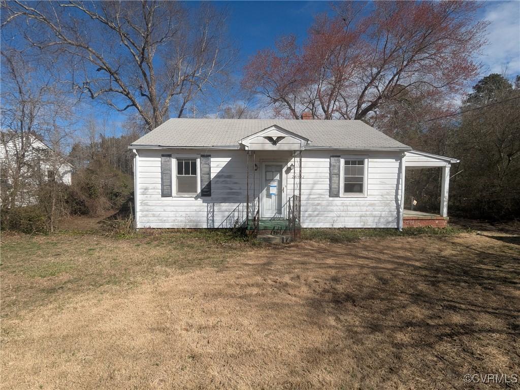 24902 River Rd, Dinwiddie, VA 23803 - bungalow-style home with a chimney and a front lawn
