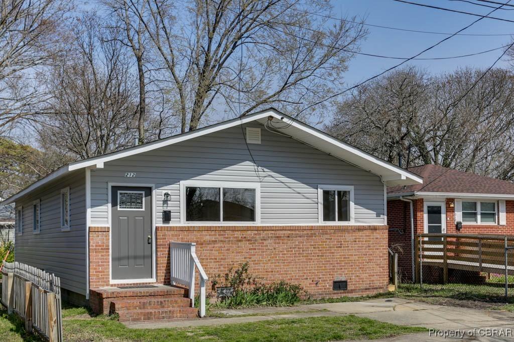 212 W Kelly Ave, Hampton, VA 23663 - bungalow-style home with fence, brick siding, and crawl space