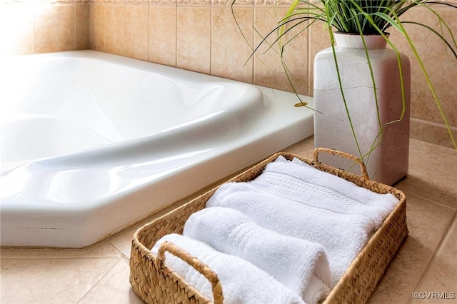 bathroom featuring tile patterned flooring and a bathtub
