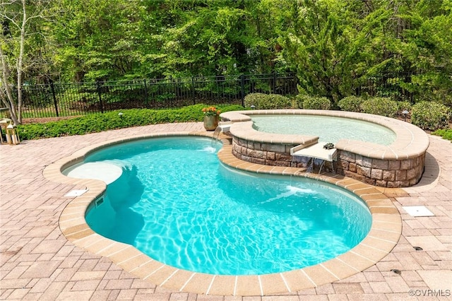 view of swimming pool with a patio area, a fenced in pool, and fence