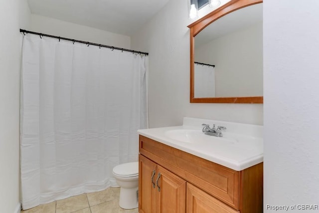 full bath featuring tile patterned floors, toilet, and vanity