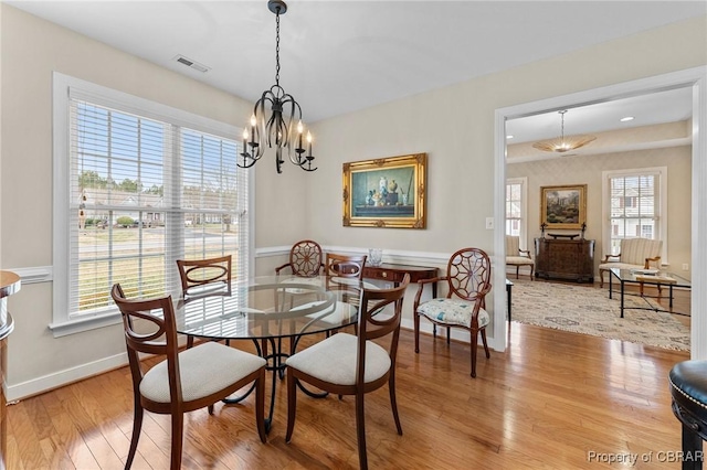 22 Crossroad, Irvington, VA 22480 - dining room featuring a chandelier, visible vents, baseboards, and light wood-style floors