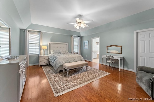 22 Crossroad, Irvington, VA 22480 - bedroom featuring ensuite bath, a ceiling fan, baseboards, and wood-type flooring
