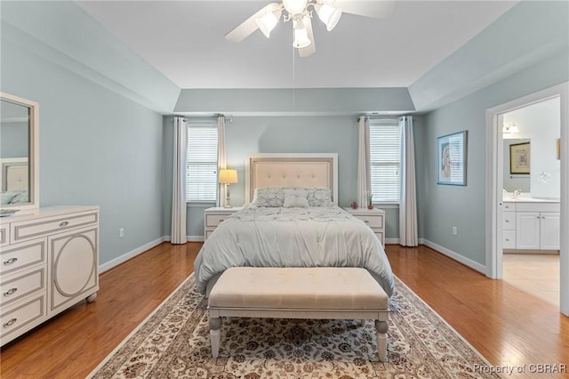 22 Crossroad, Irvington, VA 22480 - bedroom with ceiling fan, ensuite bath, light wood-type flooring, and baseboards