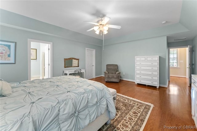 22 Crossroad, Irvington, VA 22480 - bedroom with ceiling fan, baseboards, ensuite bath, and wood finished floors
