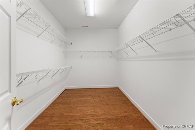 22 Crossroad, Irvington, VA 22480 - spacious closet featuring visible vents and wood finished floors