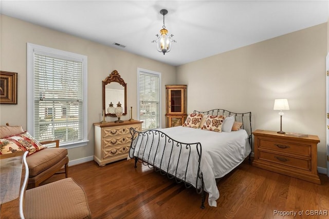 22 Crossroad, Irvington, VA 22480 - bedroom featuring multiple windows, wood finished floors, visible vents, and baseboards
