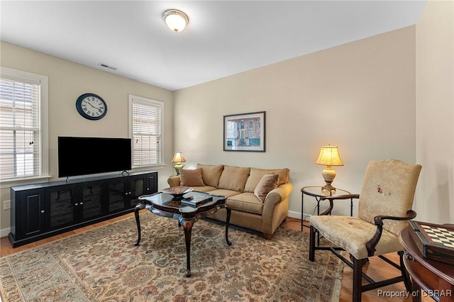 22 Crossroad, Irvington, VA 22480 - living room featuring visible vents, baseboards, and wood finished floors