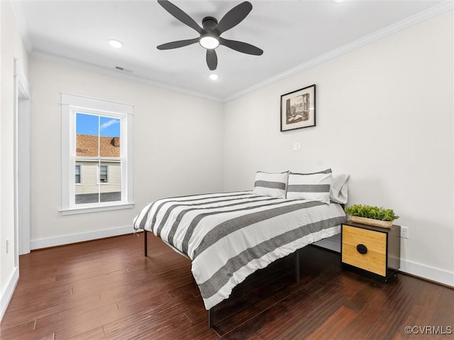 bedroom featuring crown molding, baseboards, and visible vents
