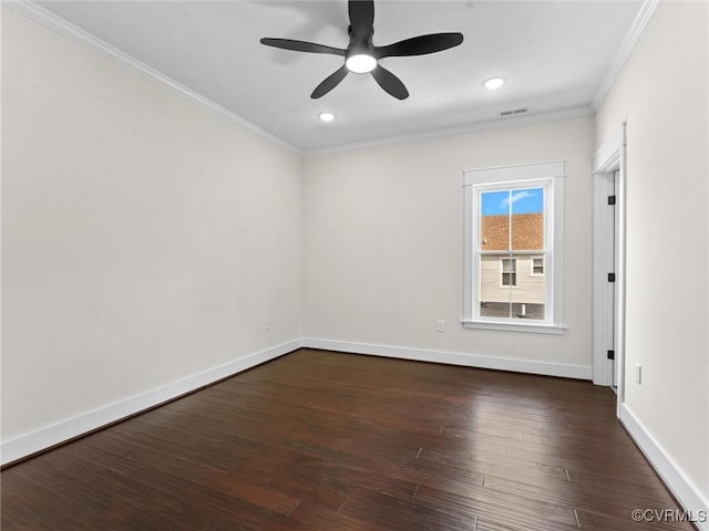 unfurnished room featuring dark wood-style flooring, ornamental molding, baseboards, and a ceiling fan