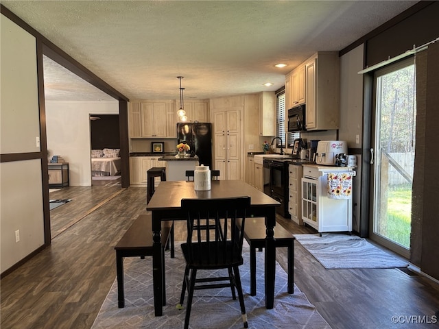 16690 Shands Rd, South Prince George, VA 23805 - dining space featuring a textured ceiling, dark wood-type flooring, and baseboards