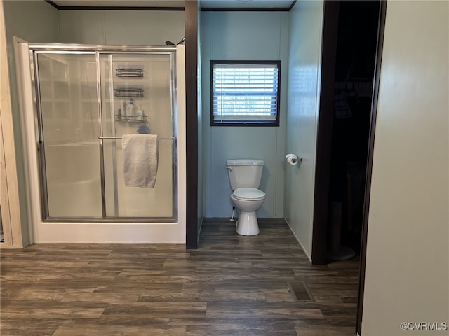 16690 Shands Rd, South Prince George, VA 23805 - full bathroom with visible vents, wood finished floors, toilet, and a stall shower
