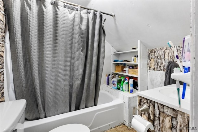 bathroom featuring toilet, shower / bath combination with curtain, and tile patterned floors