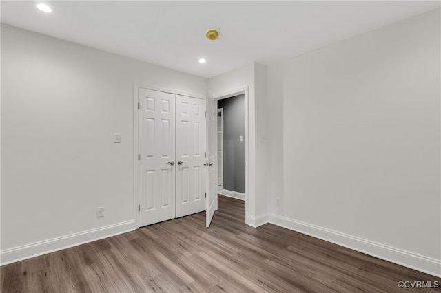 42 Mt Elba Rd, Columbia, VA 23038 - unfurnished bedroom featuring wood finished floors, baseboards, recessed lighting, and a closet