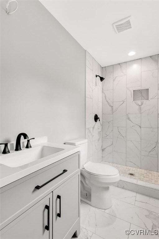42 Mt Elba Rd, Columbia, VA 23038 - full bath with marble finish flooring, a stall shower, toilet, and vanity