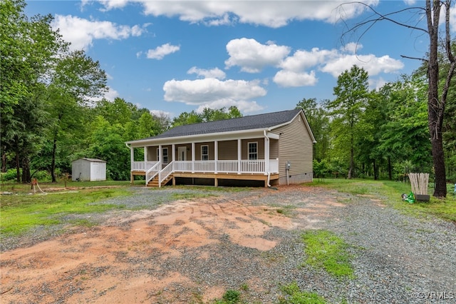 42 Mt Elba Rd, Columbia, VA 23038 - view of front of house with a porch, crawl space, a shed, and an outbuilding