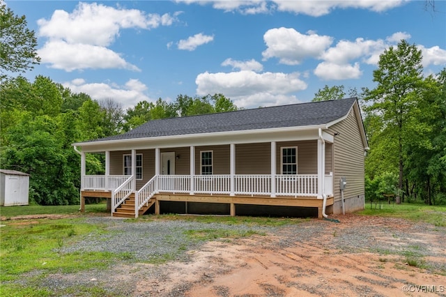 42 Mt Elba Rd, Columbia, VA 23038 - view of front of home with a porch, crawl space, a storage shed, and an outdoor structure