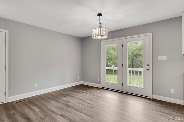 42 Mt Elba Rd, Columbia, VA 23038 - spare room featuring wood finished floors, baseboards, and a chandelier