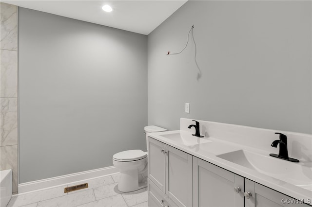 42 Mt Elba Rd, Columbia, VA 23038 - bathroom featuring marble look tile flooring, baseboards, toilet, a tub to relax in, and recessed lighting