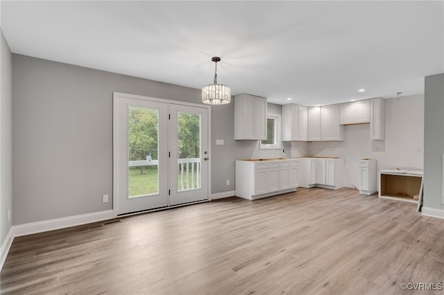 42 Mt Elba Rd, Columbia, VA 23038 - kitchen with baseboards, a chandelier, light wood-style floors, recessed lighting, and white cabinets