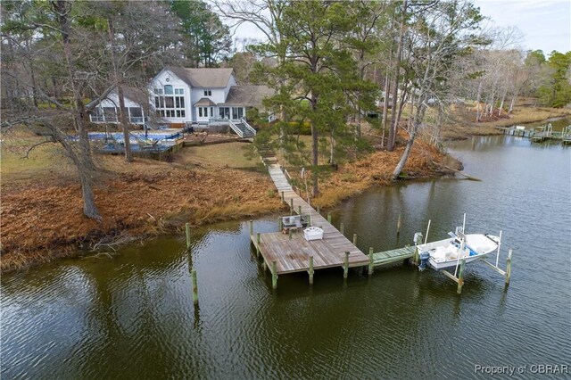 dock area with boat lift, a water view, and stairs