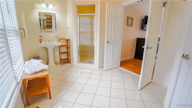 1729 Lake Forest Dr, Mineral, VA 23117 - full bathroom featuring tile patterned floors, baseboards, a sink, and a shower stall