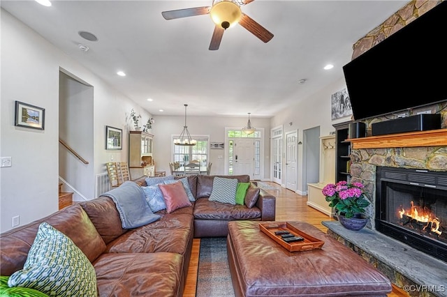 1729 Lake Forest Dr, Mineral, VA 23117 - living room featuring recessed lighting, a stone fireplace, a ceiling fan, and wood finished floors