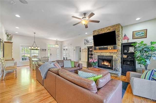 1729 Lake Forest Dr, Mineral, VA 23117 - living area featuring light wood finished floors, baseboards, recessed lighting, ceiling fan with notable chandelier, and a fireplace