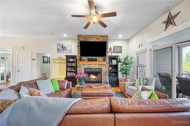 1729 Lake Forest Dr, Mineral, VA 23117 - living area featuring visible vents, recessed lighting, wood finished floors, ceiling fan, and a stone fireplace