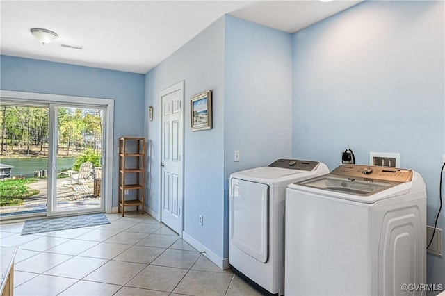 1729 Lake Forest Dr, Mineral, VA 23117 - washroom featuring baseboards, washer and dryer, laundry area, and light tile patterned floors