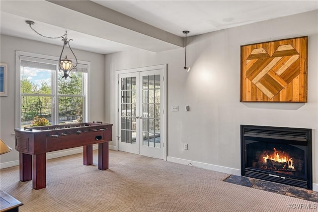 1729 Lake Forest Dr, Mineral, VA 23117 - playroom with a fireplace with flush hearth, baseboards, carpet flooring, and french doors