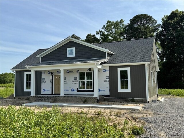 276 Safe Harbor Lndg, Hague, VA 22469 - property in mid-construction featuring covered porch and a shingled roof