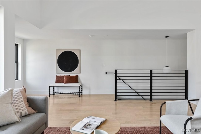1613 Pulaski St, Richmond, VA 23222 - sitting room with an upstairs landing, wood finished floors, and baseboards