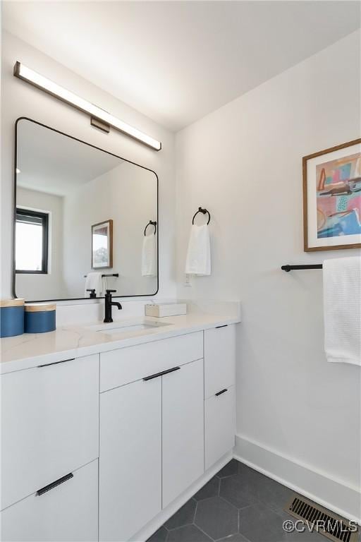 1613 Pulaski St, Richmond, VA 23222 - bathroom with vanity, visible vents, baseboards, and tile patterned flooring
