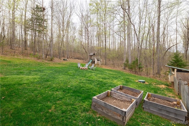 1635 Dorset Meadows Ln, Powhatan, VA 23139 - view of green lawn featuring a playground and a vegetable garden