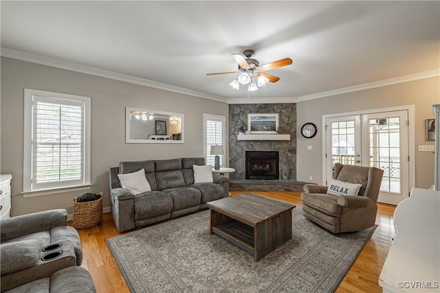 1635 Dorset Meadows Ln, Powhatan, VA 23139 - living area with crown molding, a ceiling fan, healthy amount of natural light, light wood-style flooring, and french doors