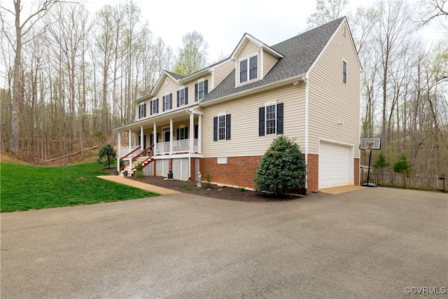 1635 Dorset Meadows Ln, Powhatan, VA 23139 - view of front of house featuring a porch, driveway, a shingled roof, a garage, and a front yard